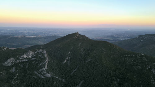 Scenic view of mountains against sky during sunset