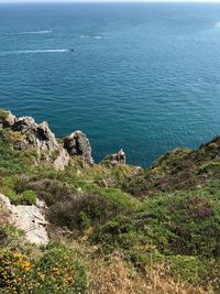 High angle view of rocks by sea