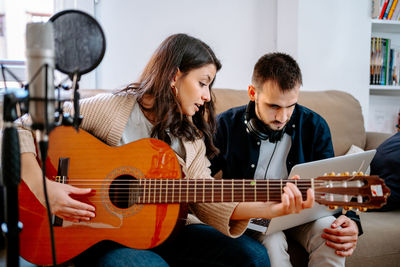 People playing guitar