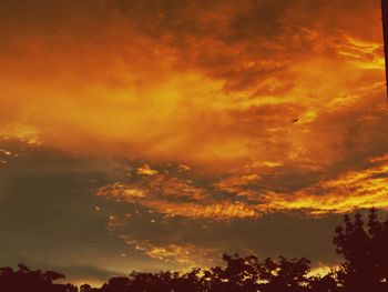 Low angle view of cloudy sky at sunset