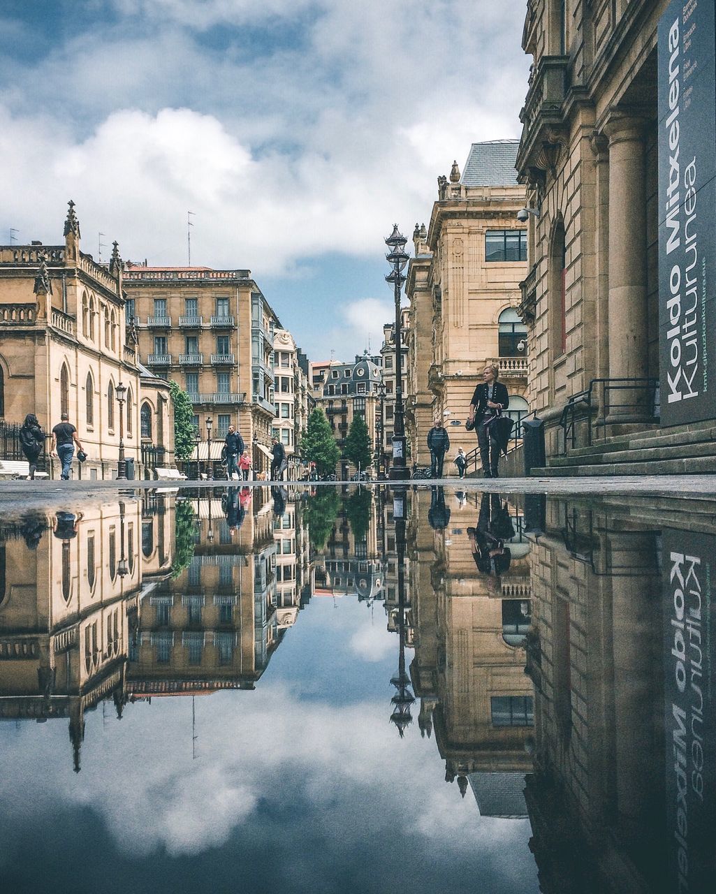 building exterior, reflection, architecture, built structure, cloud - sky, water, sky, waterfront, city, nature, building, day, symmetry, lake, travel destinations, history, the past, outdoors, incidental people, reflecting pool