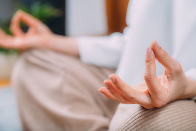 Meditating woman. peaceful woman sitting in a lotus position and meditating.