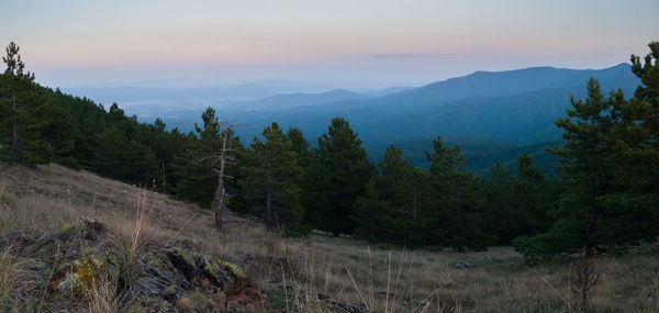 Scenic view of mountains against sky during sunset