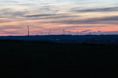 Silhouette landscape against sky during sunset