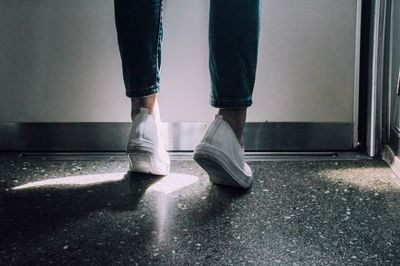 Low section of woman standing on floor