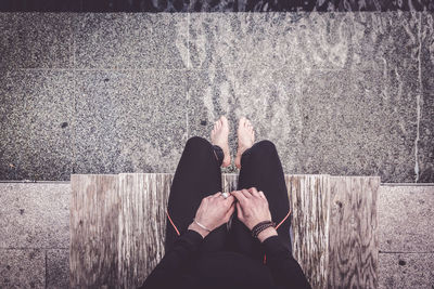 Low section of woman standing on floor