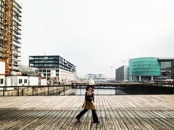 Full length of woman standing in city