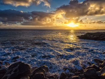 Scenic view of sea against sky during sunset