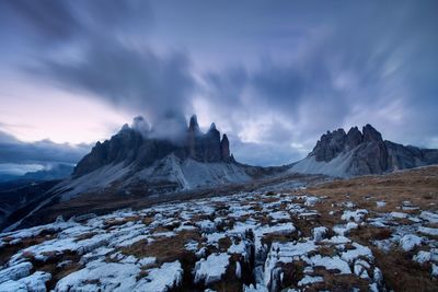 Scenic view of snow covered mountains against sky