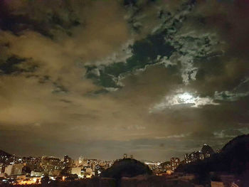 Cityscape against dramatic sky