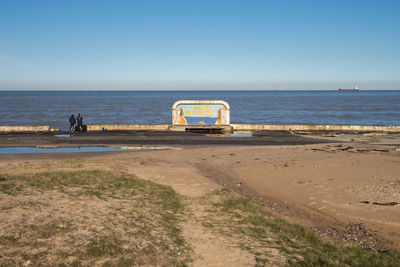 Scenic view of beach against clear sky