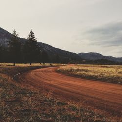 Road passing through field