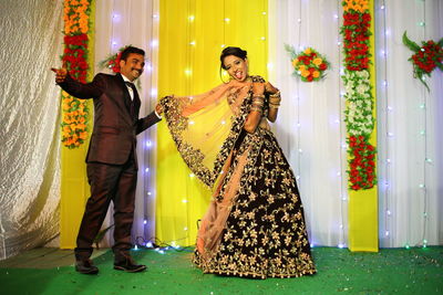 Portrait of cheerful couple at wedding