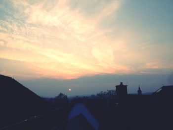 Silhouette of built structure at sunset