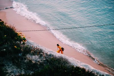 High angle view of man surfing in sea