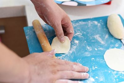 Close-up of person preparing food on table