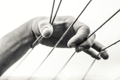 Close-up of hand holding guitar