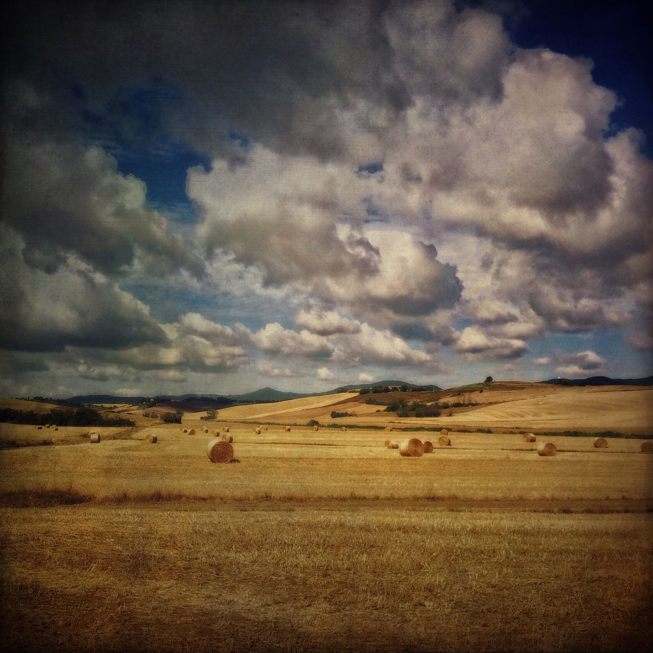 sky, cloud - sky, cloudy, landscape, tranquil scene, tranquility, scenics, cloud, beauty in nature, nature, weather, field, overcast, horizon over land, storm cloud, idyllic, no people, remote, outdoors, non-urban scene