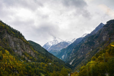 Scenic view of mountains against cloudy sky