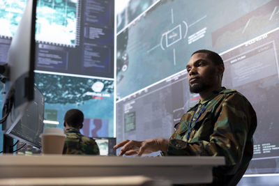 Portrait of young man working in office