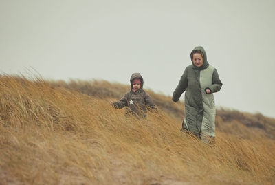 Side view of woman standing on field