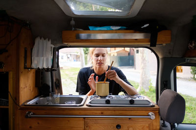 Portrait of man sitting in car