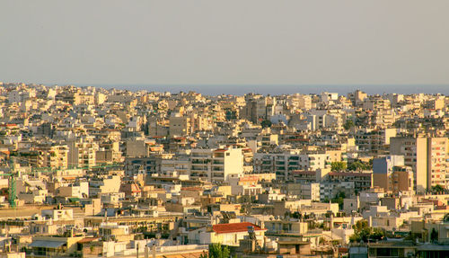 High angle view of buildings in city against clear sky