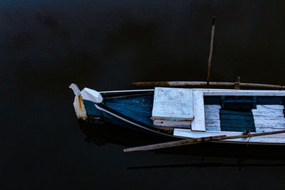 Boat moored in lake. 