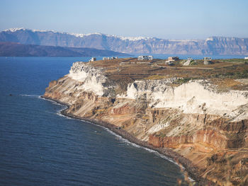 Scenic view of sea and mountains against sky