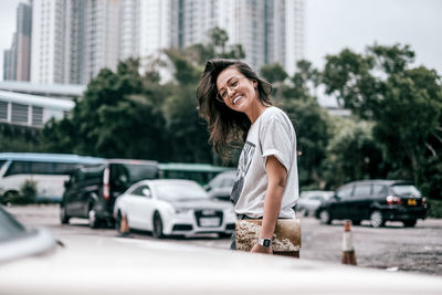 Portrait of smiling man on street in city