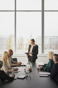 Business people having meeting in boardroom