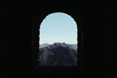 Scenic view of mountains seen through window