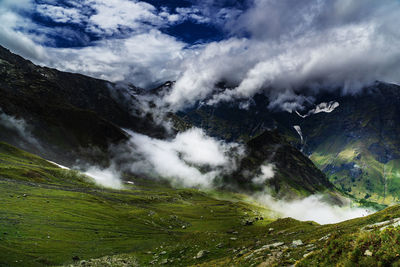 Scenic view of waterfall against sky