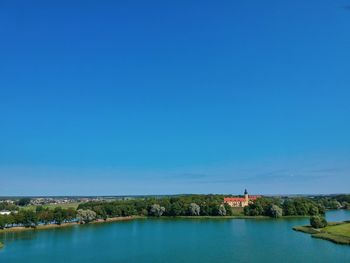 Scenic view of sea against clear blue sky