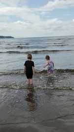 Boy standing on beach