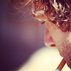 Close-up of man smoking cigarette