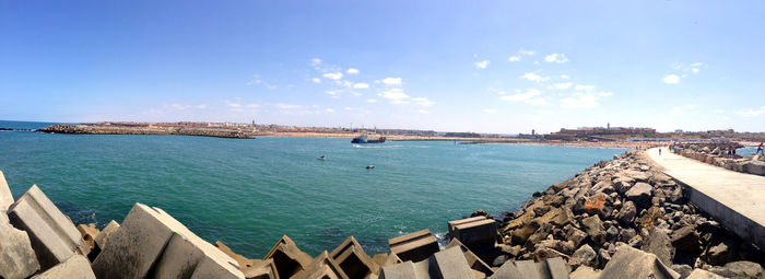 Panoramic view of bay against sky