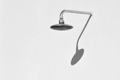 Close-up of electric lamp against white background