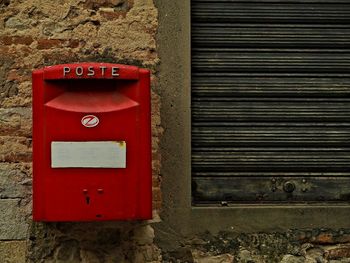 Red mailbox on wall