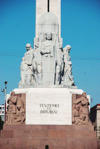 View of statue against blue sky