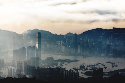 Panoramic view of cityscape against sky during sunset