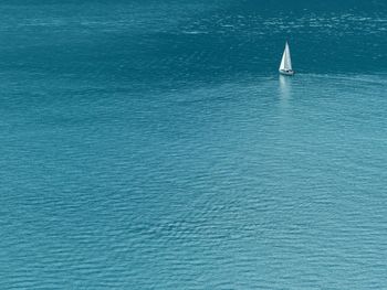 High angle view of sailboat sailing in sea