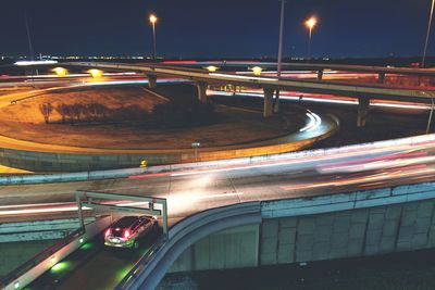 Light trails on road in city at night