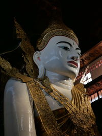 Low angle view of statue against building