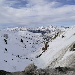 Scenic view of mountains against sky during winter