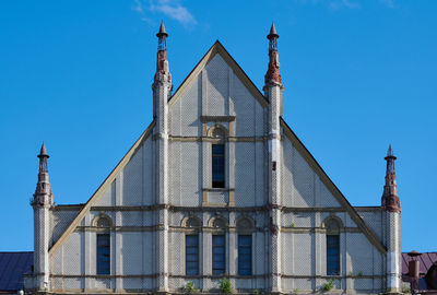 Low angle view of buildings against blue sky