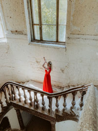 Vintage stairs woman in red castle old style 