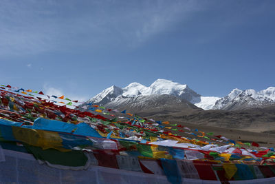 Scenic view of mountains against blue sky