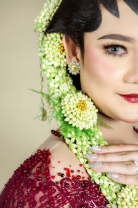 Beautiful model, wearing javanese indonesian wedding dress.