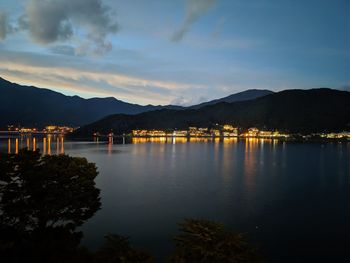 Scenic view of lake against sky at night